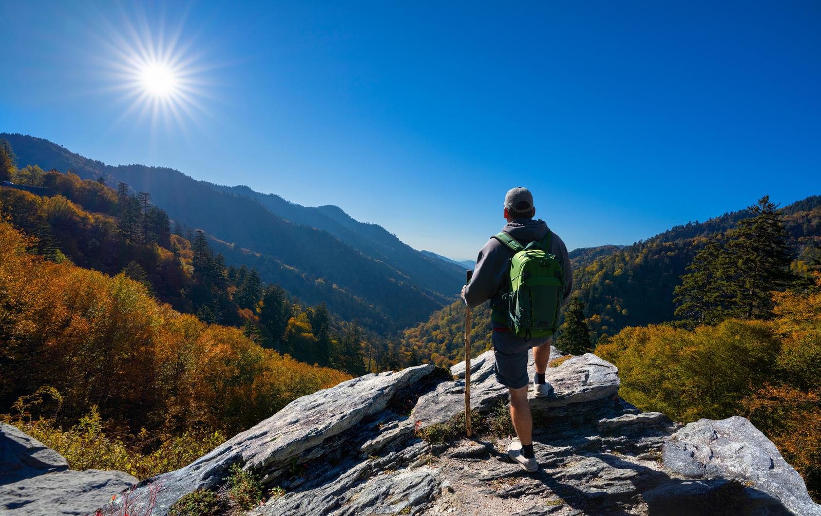 hiker on mountain rock