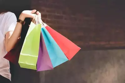 woman holding shopping bags