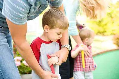 kids playing mini golf