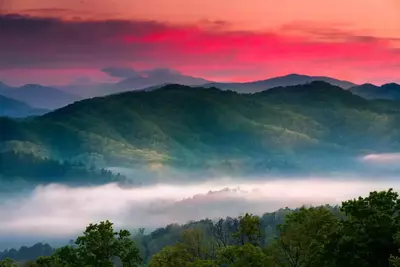 Sunrise over the Great Smoky Mountains with a layer of mist