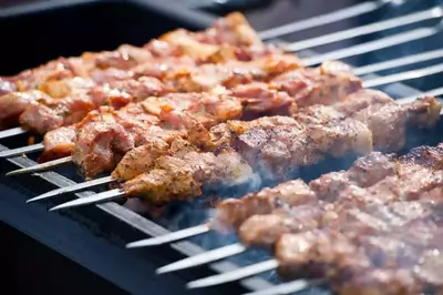 Meat kebabs on the grill.