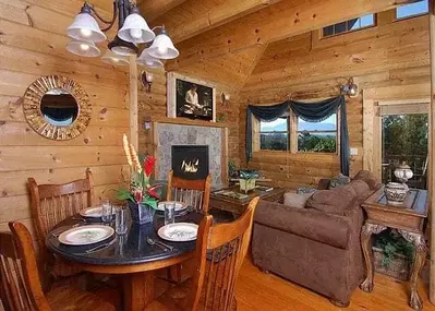 The living room and dining area in a Slice of Paradise cabin in Gatlinburg.