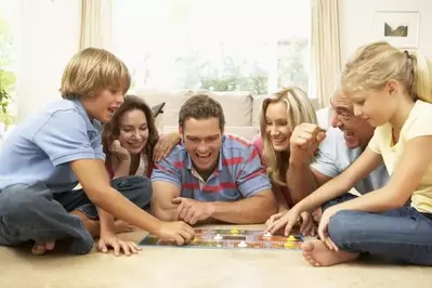 Family playing a board game