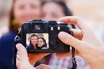 mom and daughter taking a photo during their Gatlinburg cabin vacation