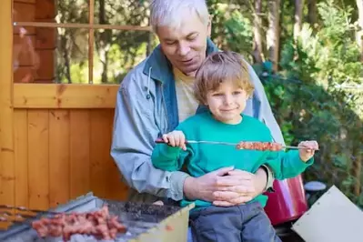 Grandfather and grandson enjoying a Gatlinburg cabin vacation