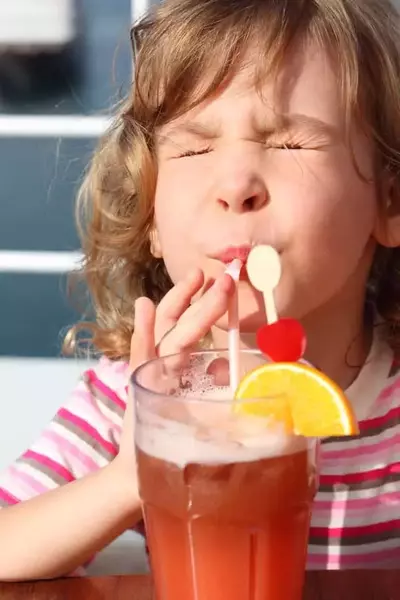 kid drinking sweet tea in a Gatlinburg cabin