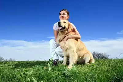 woman with a golden retriever