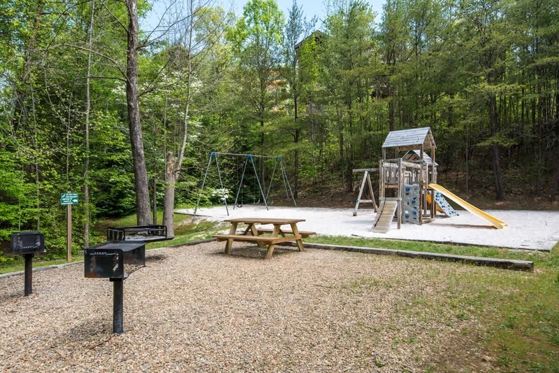 Resort Playground w/ Picnic Table Seating Areas