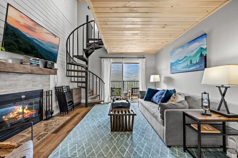 Open living area with access stairs to loft