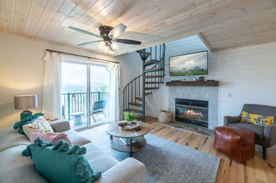 Angle of living area with fireplace & Smart TV