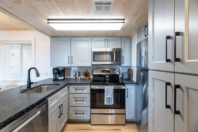 Features all stainless steel appliances and is fully stocked with all kitchen essentials