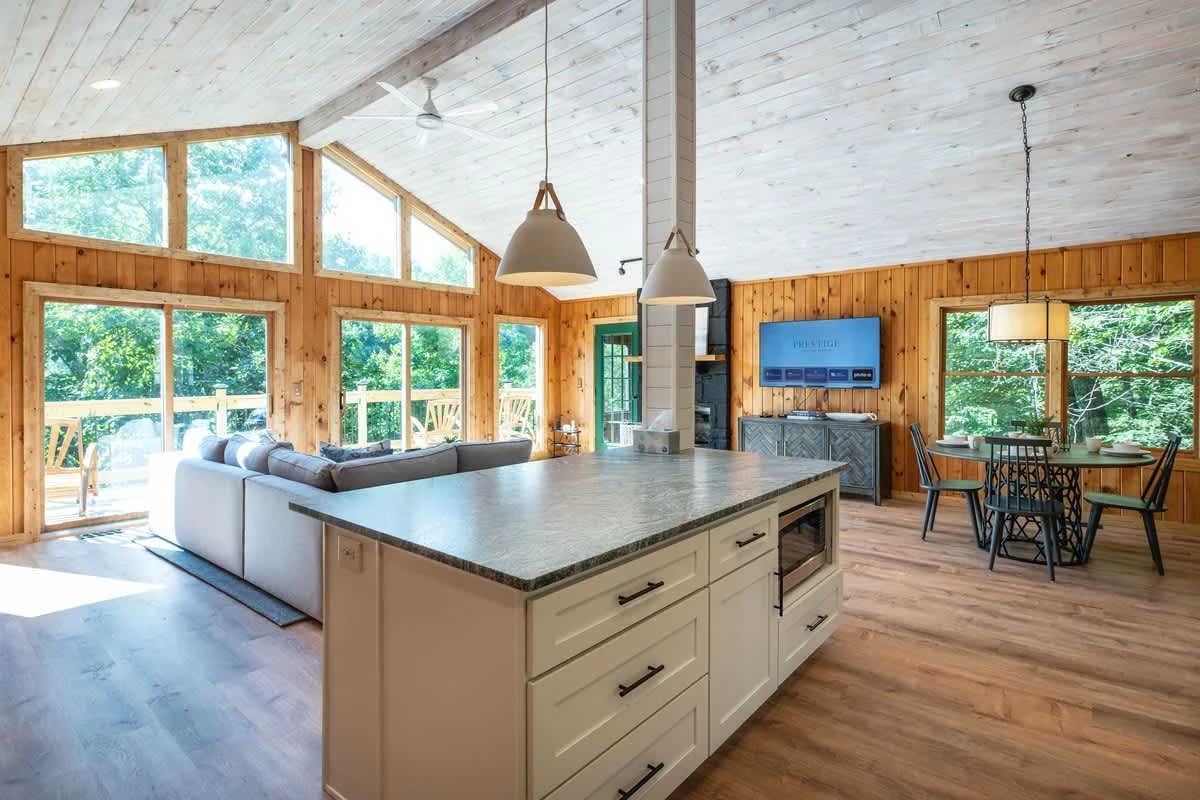 Open concept living and dining area are adjacent to kitchen.