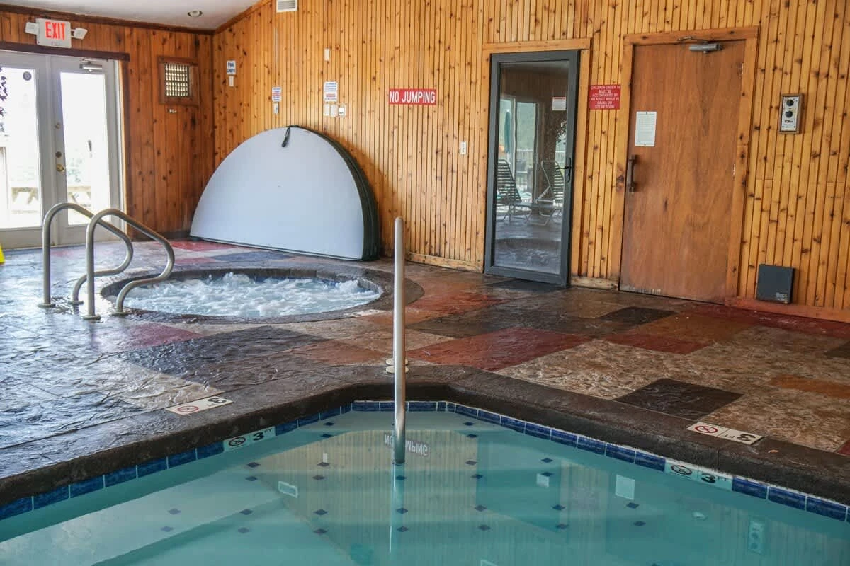 The indoor pool area includes a hot tub, steam room, and sauna.