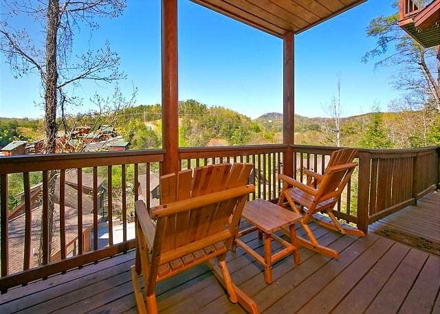 Two rocking chairs on the deck of a Pigeon Forge cabin rental